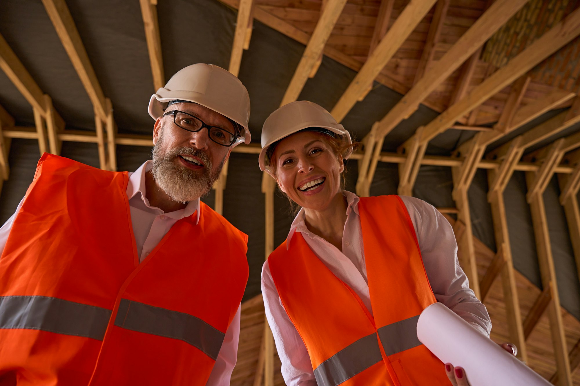 Foreman and construction supervisor posing for camera during house inspection
